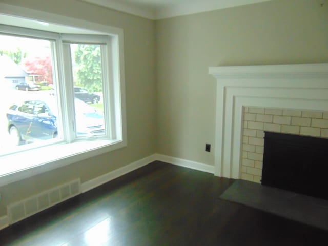 10114 Lincoln Dr, Huntington Woods, MI 48070 - unfurnished living room featuring a fireplace, dark wood finished floors, and baseboards