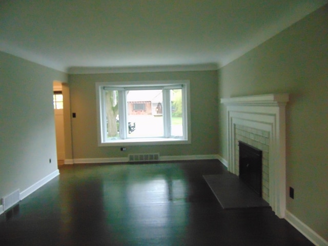 10114 Lincoln Dr, Huntington Woods, MI 48070 - unfurnished living room with a fireplace, baseboards, and dark wood-style floors
