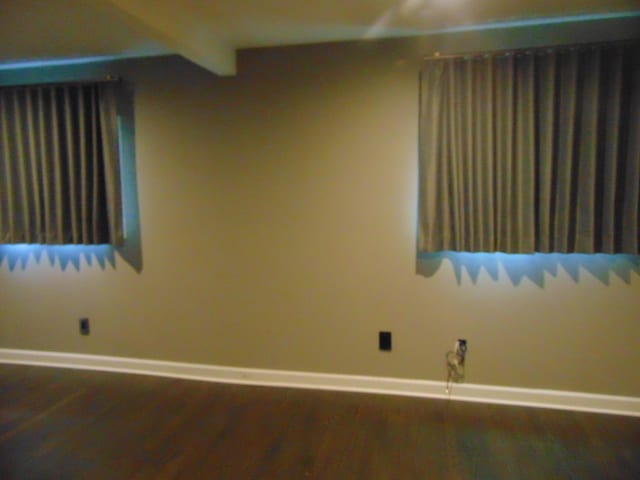 10114 Lincoln Dr, Huntington Woods, MI 48070 - empty room with baseboards, wood finished floors, and beam ceiling