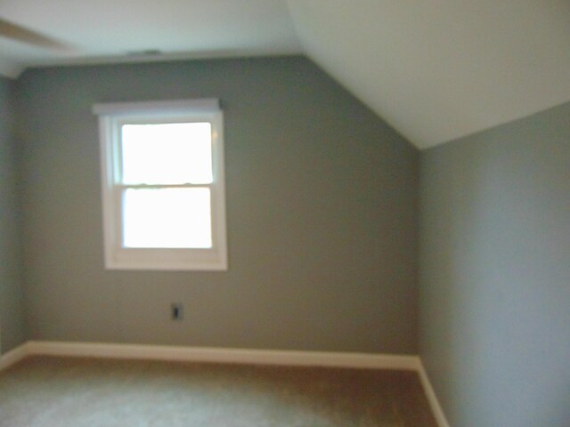 10114 Lincoln Dr, Huntington Woods, MI 48070 - additional living space featuring lofted ceiling, baseboards, and carpet floors