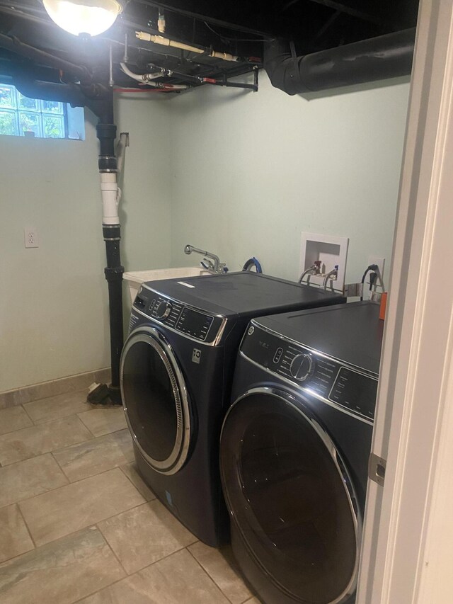 10114 Lincoln Dr, Huntington Woods, MI 48070 - washroom featuring separate washer and dryer and light tile patterned flooring