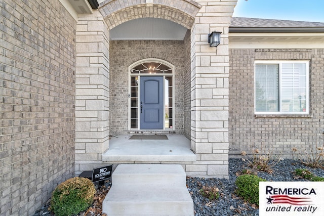 52951 Royal Park Ave, Utica, MI 48315 - view of exterior entry featuring brick siding and roof with shingles
