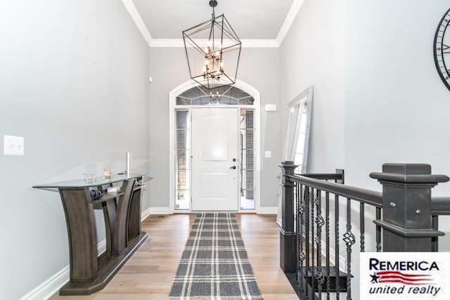 52951 Royal Park Ave, Utica, MI 48315 - foyer entrance with a chandelier, crown molding, wood finished floors, and a high ceiling