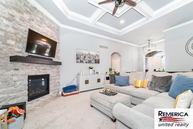 52951 Royal Park Ave, Utica, MI 48315 - living room featuring a ceiling fan, arched walkways, a fireplace, crown molding, and beamed ceiling