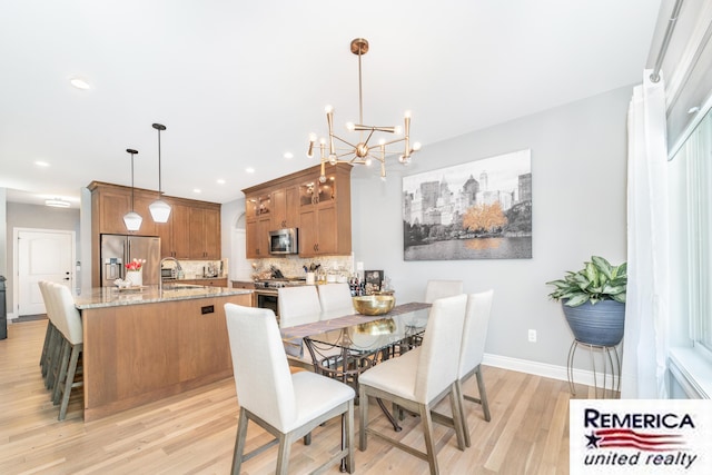 52951 Royal Park Ave, Utica, MI 48315 - dining area featuring light wood-style flooring, a chandelier, and recessed lighting