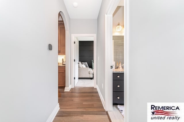 52951 Royal Park Ave, Utica, MI 48315 - corridor featuring wood finished floors and arched walkways
