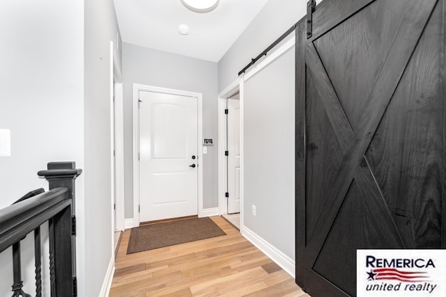 52951 Royal Park Ave, Utica, MI 48315 - hallway with light wood finished floors and a barn door