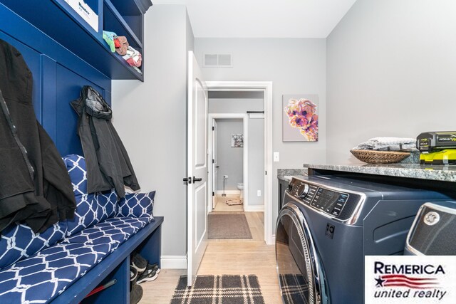 52951 Royal Park Ave, Utica, MI 48315 - laundry area with wood finished floors and washing machine and dryer