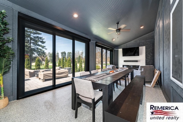 52951 Royal Park Ave, Utica, MI 48315 - dining room with speckled floor, a ceiling fan, vaulted ceiling, a large fireplace, and recessed lighting