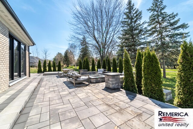52951 Royal Park Ave, Utica, MI 48315 - view of patio featuring a fire pit