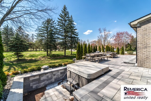 52951 Royal Park Ave, Utica, MI 48315 - view of patio featuring outdoor dining area, a hot tub, and view of wooded area