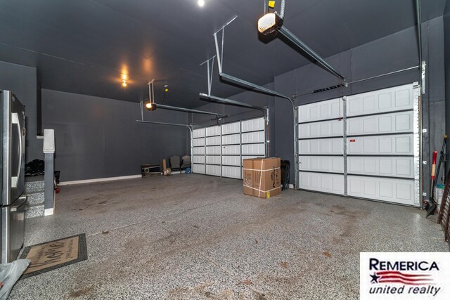 52951 Royal Park Ave, Utica, MI 48315 - garage featuring freestanding refrigerator and a garage door opener