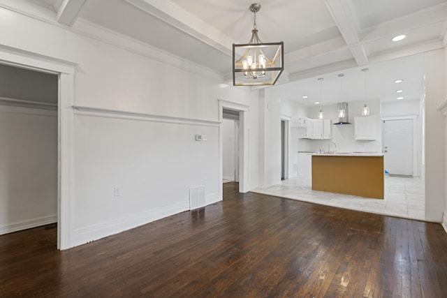 3008 Lothrop St, Detroit, MI 48206 - unfurnished living room featuring light wood-type flooring, beamed ceiling, coffered ceiling, a chandelier, and recessed lighting