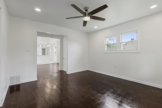 3008 Lothrop St, Detroit, MI 48206 - empty room featuring wood-type flooring, ceiling fan, and a chandelier