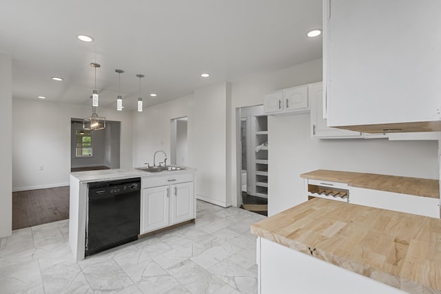 3008 Lothrop St, Detroit, MI 48206 - kitchen with black dishwasher, recessed lighting, white cabinets, decorative light fixtures, and a center island with sink