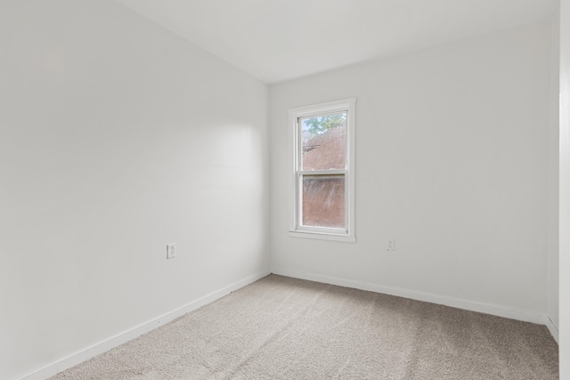 3008 Lothrop St, Detroit, MI 48206 - spare room featuring light carpet and baseboards