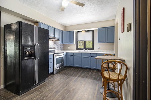 6236 Arbutus, Idlewild, MI 49642 - kitchen featuring black fridge with ice dispenser, stainless steel electric range, under cabinet range hood, a textured ceiling, and dark wood-type flooring