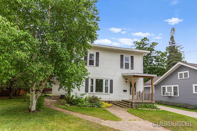 409 Rust Ave, Big Rapids, MI 49307 - view of front facade with a front lawn and cooling unit