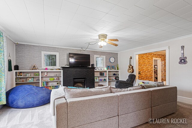 409 Rust Ave, Big Rapids, MI 49307 - carpeted living area featuring a brick fireplace, crown molding, and ceiling fan