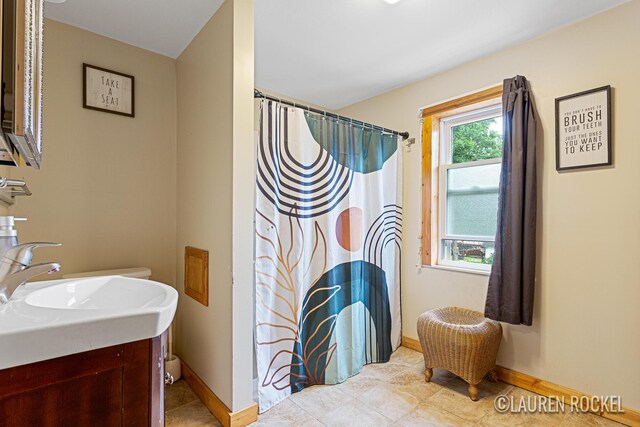 409 Rust Ave, Big Rapids, MI 49307 - bathroom featuring vanity, tile patterned flooring, and a shower with curtain