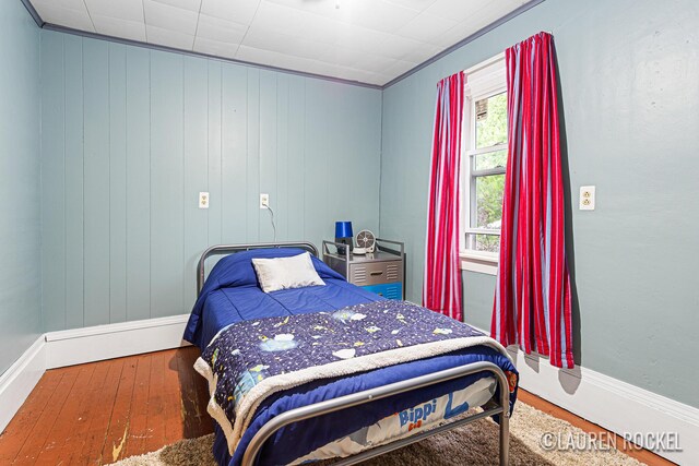 409 Rust Ave, Big Rapids, MI 49307 - bedroom featuring wood finished floors and baseboards