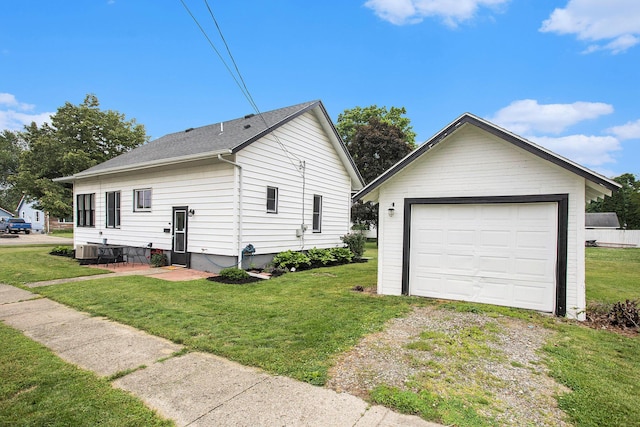 255 E Corey St, Bronson, MI 49028 - view of home's exterior with driveway, a lawn, and a detached garage