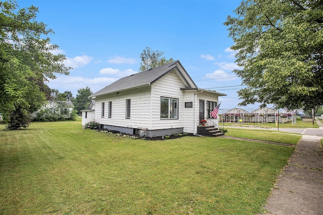 255 E Corey St, Bronson, MI 49028 - view of side of property with a yard