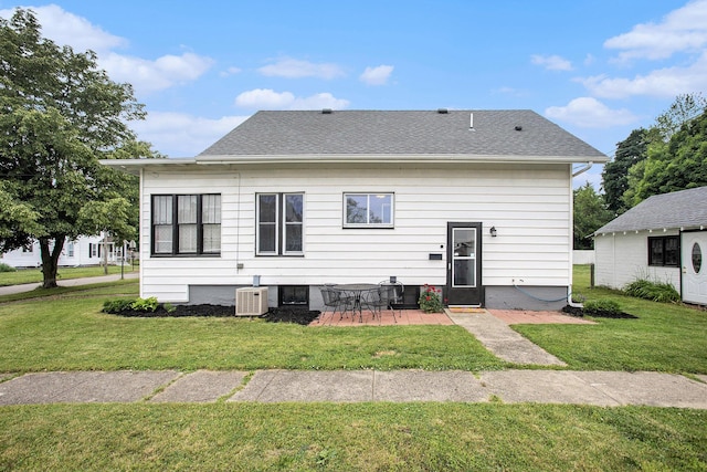 255 E Corey St, Bronson, MI 49028 - rear view of house featuring a yard, a patio area, and roof with shingles