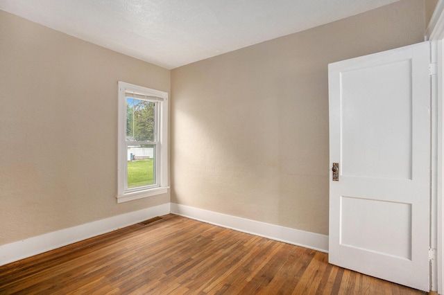 255 E Corey St, Bronson, MI 49028 - spare room featuring wood finished floors and baseboards