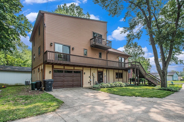 50041 David Dr, Dowagiac, MI 49047 - view of property with a balcony, a front yard, driveway, stairs, and an attached garage