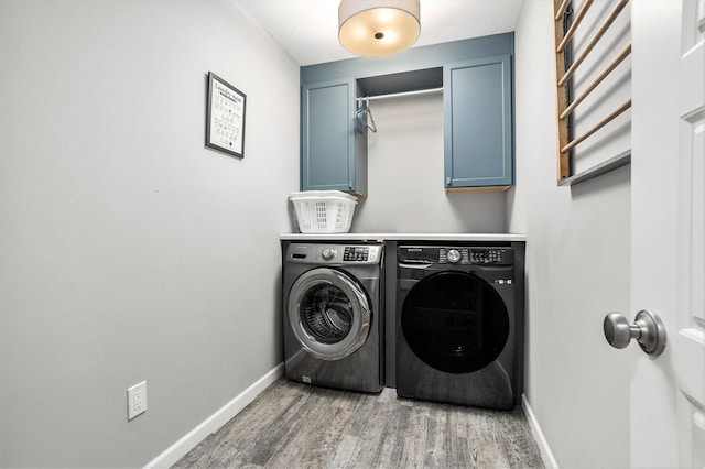 3935 Riley Rdg, Portage, MI 49024 - laundry room with washing machine and clothes dryer, cabinet space, and light wood-style flooring