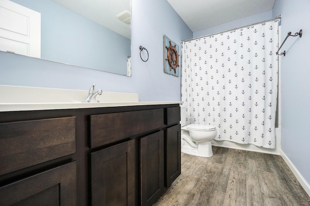 3935 Riley Rdg, Portage, MI 49024 - full bath featuring wood finished floors, vanity, and shower / tub combo