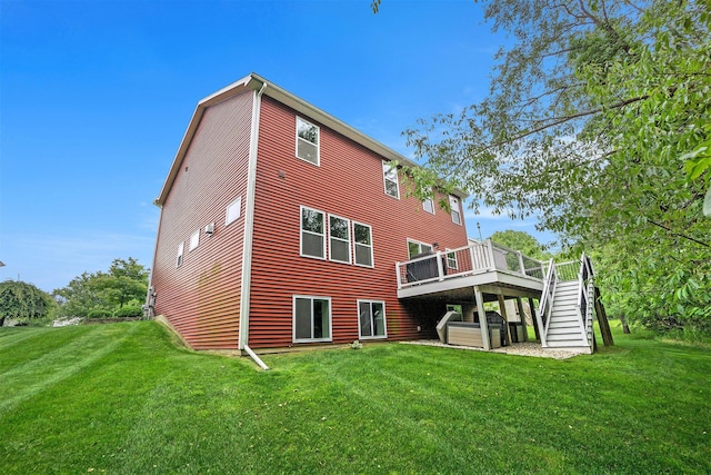 3935 Riley Rdg, Portage, MI 49024 - back of house with stairs, a deck, and a yard