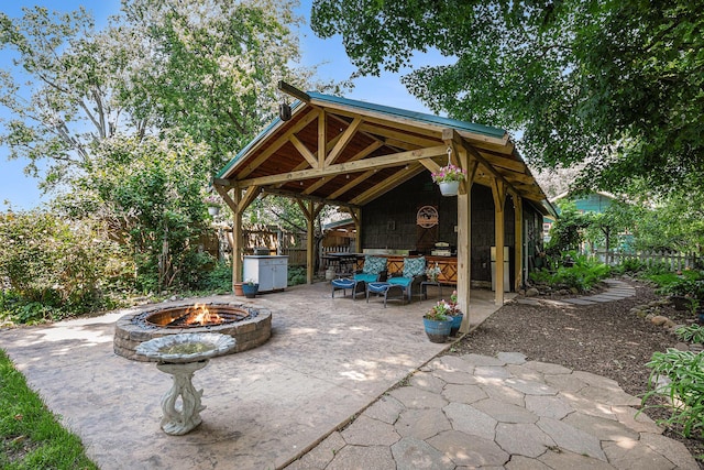 106 E Mechanic St, Yale, MI 48097 - view of patio with a fire pit
