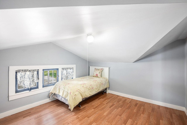 106 E Mechanic St, Yale, MI 48097 - bedroom featuring lofted ceiling, wood finished floors, and a ceiling fan