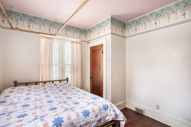 106 E Mechanic St, Yale, MI 48097 - bedroom with dark wood-style floors and baseboards