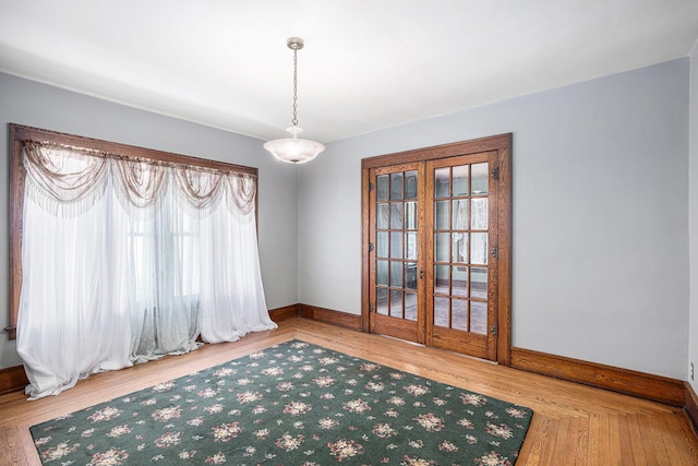 106 E Mechanic St, Yale, MI 48097 - empty room featuring french doors and wood finished floors
