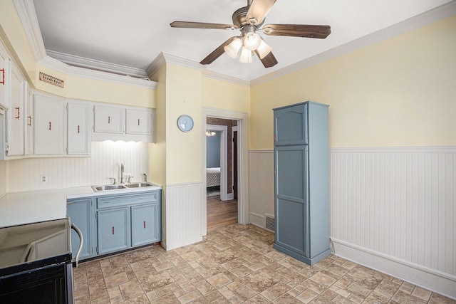 106 E Mechanic St, Yale, MI 48097 - kitchen featuring blue cabinets, range with electric stovetop, stone finish flooring, ceiling fan, and light countertops