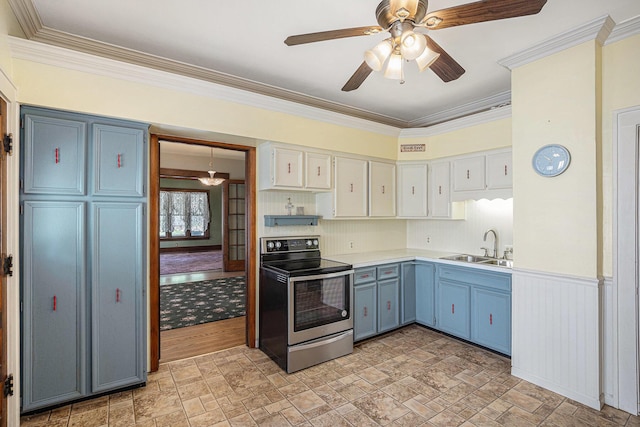 106 E Mechanic St, Yale, MI 48097 - kitchen featuring stainless steel electric stove, stone finish flooring, light countertops, blue cabinetry, and ornamental molding