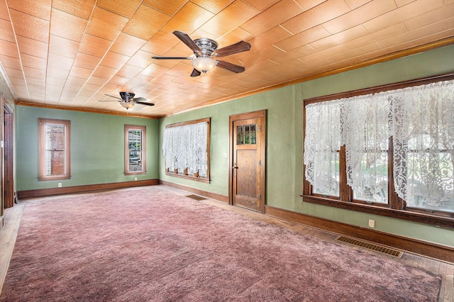 106 E Mechanic St, Yale, MI 48097 - carpeted spare room featuring ornamental molding, a ceiling fan, and plenty of natural light