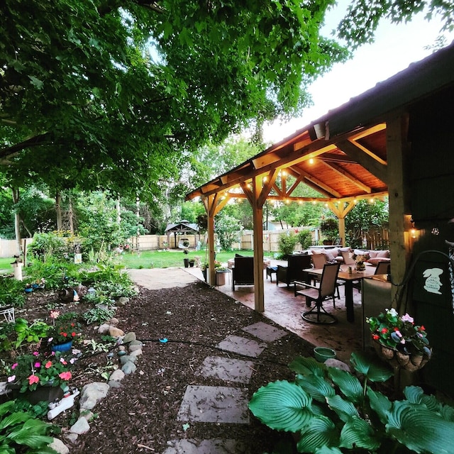 106 E Mechanic St, Yale, MI 48097 - fenced backyard with a gazebo, an outdoor living space, and a patio