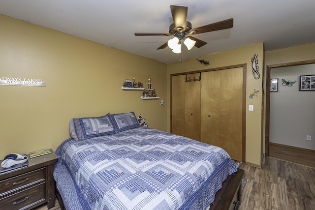 7715 Marquis Dr, Dexter, MI 48130 - bedroom with a closet, wood finished floors, and ceiling fan