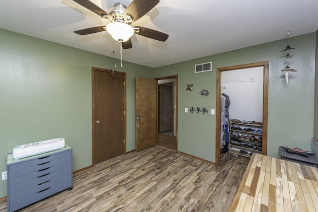 7715 Marquis Dr, Dexter, MI 48130 - foyer entrance featuring wood finished floors and a ceiling fan