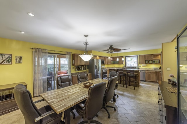 7715 Marquis Dr, Dexter, MI 48130 - dining room with stone tile flooring and a ceiling fan