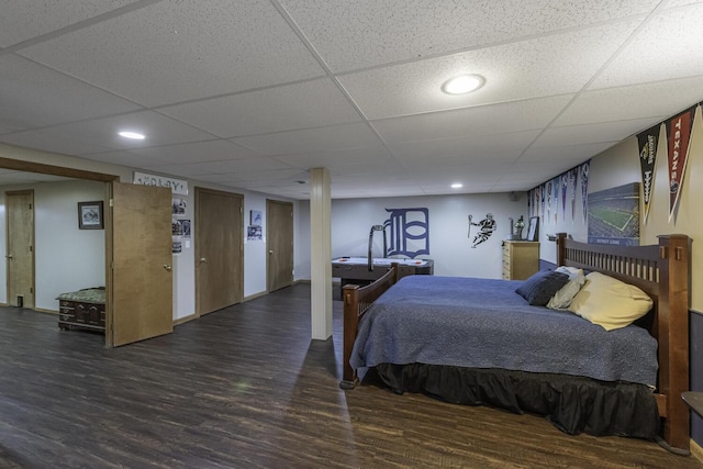 7715 Marquis Dr, Dexter, MI 48130 - bedroom featuring wood finished floors, a paneled ceiling, and recessed lighting