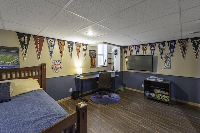 7715 Marquis Dr, Dexter, MI 48130 - bedroom featuring a drop ceiling, wood finished floors, and a desk