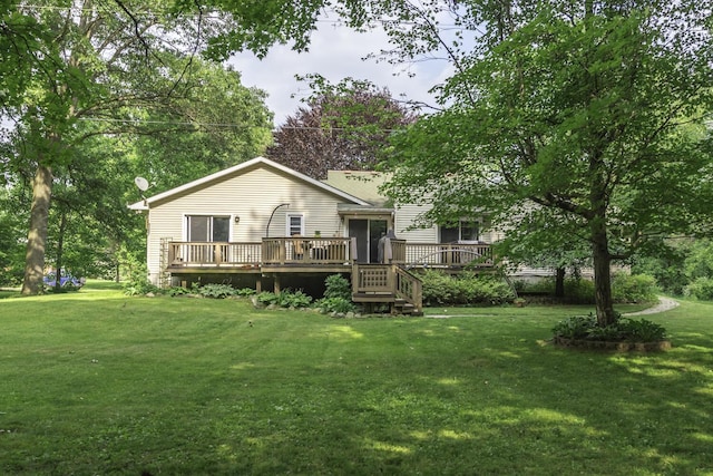 7715 Marquis Dr, Dexter, MI 48130 - back of house featuring a deck and a yard