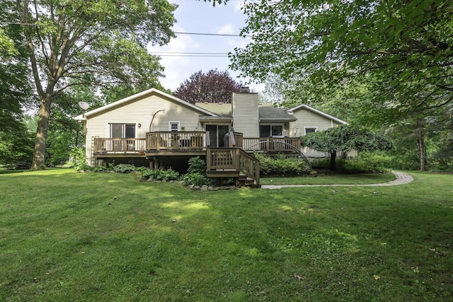 7715 Marquis Dr, Dexter, MI 48130 - back of house with a chimney, a deck, and a lawn
