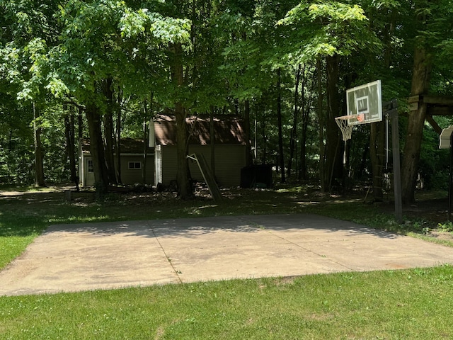 7715 Marquis Dr, Dexter, MI 48130 - view of basketball court with basketball court and a lawn