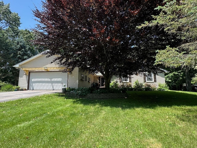 7715 Marquis Dr, Dexter, MI 48130 - view of front facade with an attached garage, driveway, and a front yard